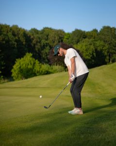 golfer using gap wedge