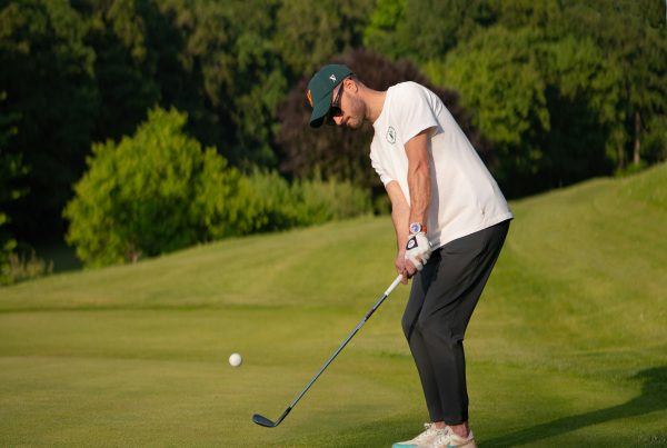 golfer using gap wedge